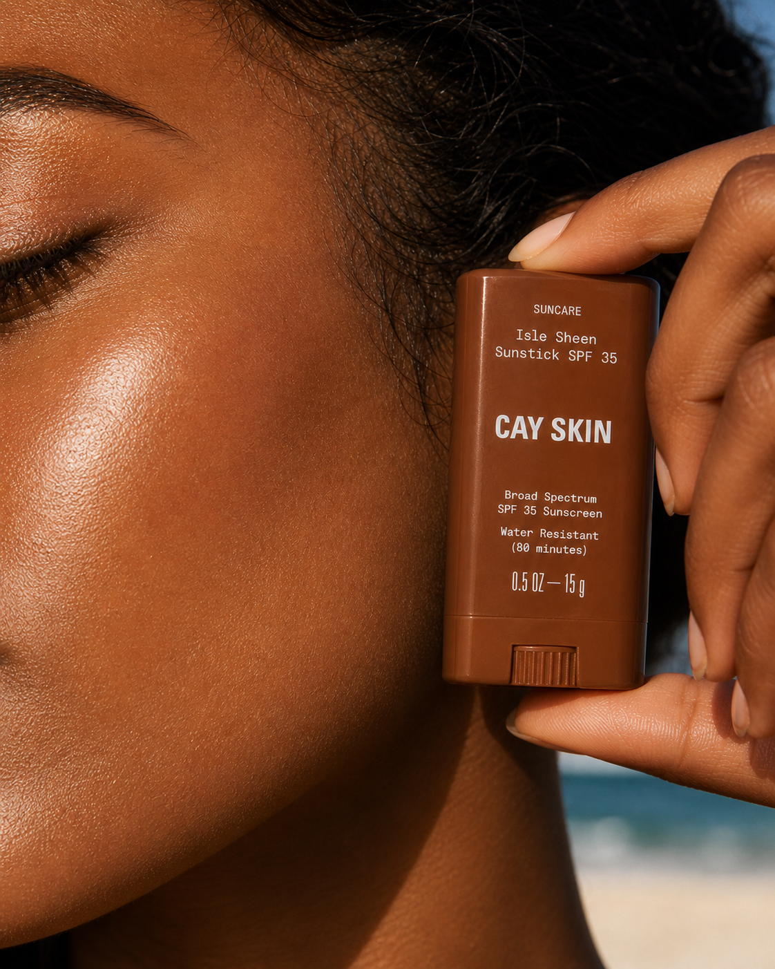 Isle Invisible Sunstick applied at the cheekbone